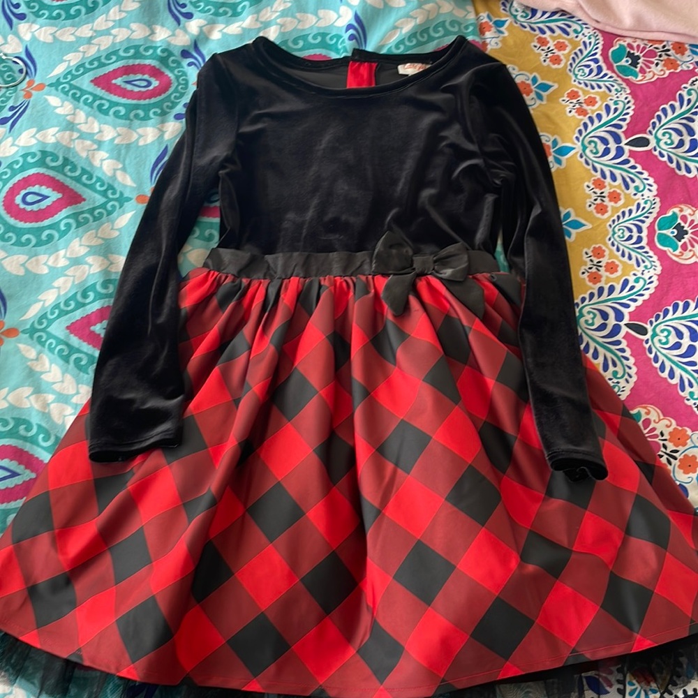 Christmas Dress it’s Velvet at the top and Satin at the bottom.